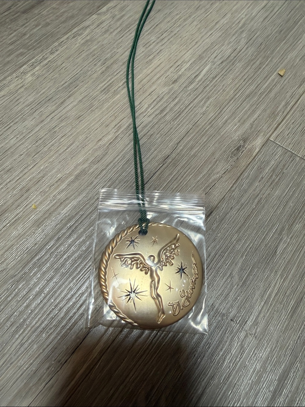 Gold-tone Angel Medallion Pendant with Green Cord